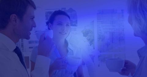 Professional colleagues enjoying coffee break with city view