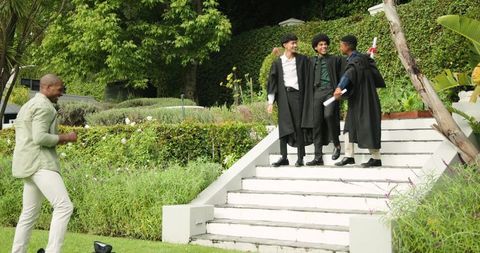 Father Captures Happy Graduates Celebrating Achievement in Garden