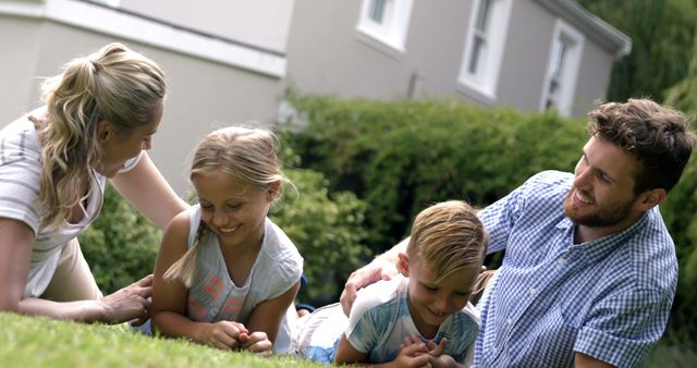 Happy Family Enjoying Time Together on Lawn - Download Free Stock Images Pikwizard.com