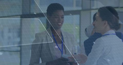 Businesswomen Engaging in Corporate Networking Event