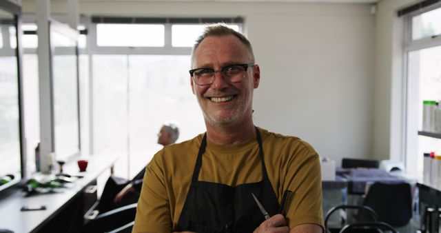 Confident Male Hairdresser with Glasses Smiling in Modern Salon - Download Free Stock Images Pikwizard.com