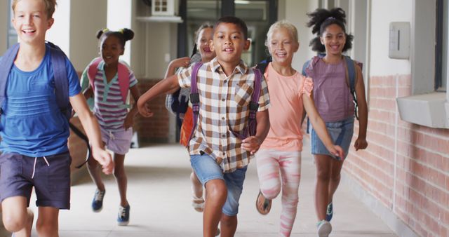 Group of diverse children running down school hallway with excitement and backpacks, eager for classes or activities. Ideal for themes of education, childhood, friendship, and school life. Suitable for advertisements, educational materials, websites, and back-to-school campaigns.