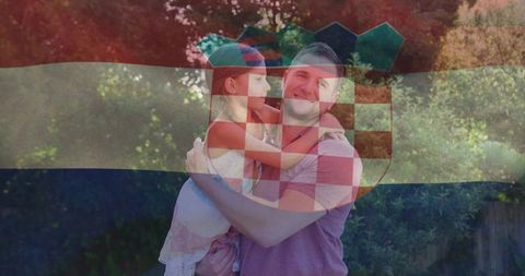 Father holding daughter in sunlit backyard smiling with croatian flag overlay