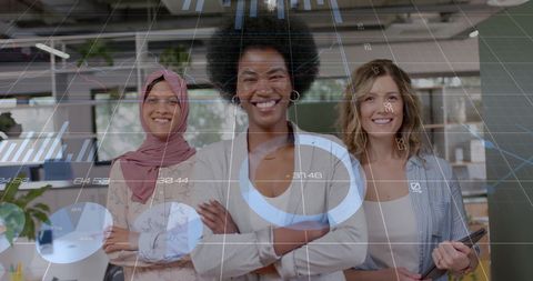 Empowered Businesswomen in Office Analyzing Financial Data