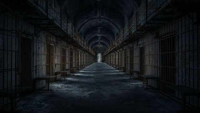 Industrial Abandoned Prison Corridor Under Eerie Lighting