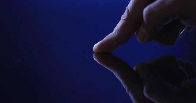 Hand Touching Reflective Surface in Dim Light - Download Free Stock Images Pikwizard.com