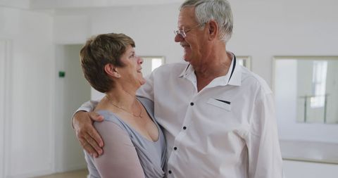 Senior Couple Smiling Embracing in Dance Class Expression Joy
