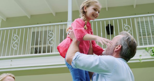 Father Lifting Happy Daughter Outdoors in Sunny Backyard - Download Free Stock Images Pikwizard.com