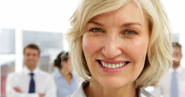 Confident Senior Businesswoman Smiling in Office Environment - Download Free Stock Images Pikwizard.com