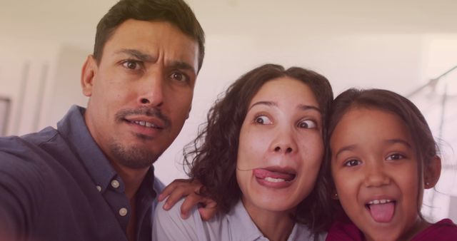 Joyful Biracial Family Making Funny Faces Together - Download Free Stock Images Pikwizard.com