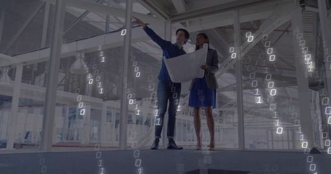 Architects Analyzing Digital Construction Plan in Modern Building Project