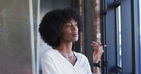 Confident digital nomad woman admiring city view