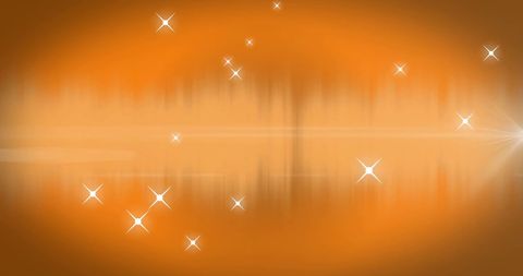 Abstract light spots on a vibrant orange background