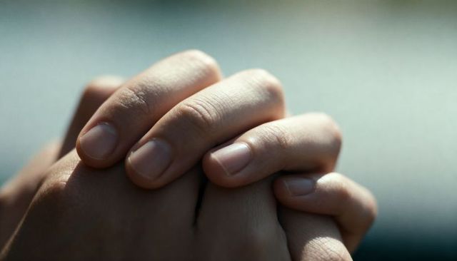Close-up Interlocked Hands Showing Skin Texture, Human Fingernails and Emotional Connection