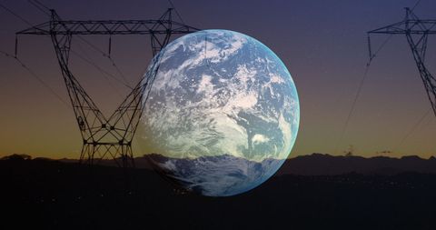 Earth overlaid on electricity pylon silhouette at twilight