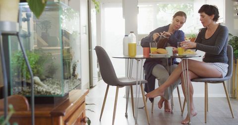 Couple Sharing Morning Coffee During Relaxed Breakfast at Home