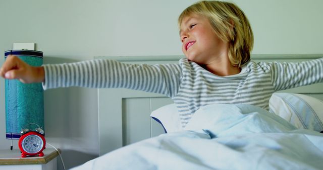 Happy Child Waking Up with Smile in Bed - Download Free Stock Images Pikwizard.com