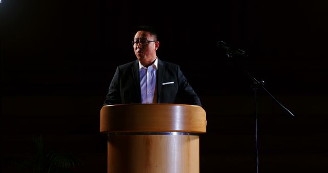 Confident Male Speaker Delivering Speech from Podium - Download Free Stock Images Pikwizard.com