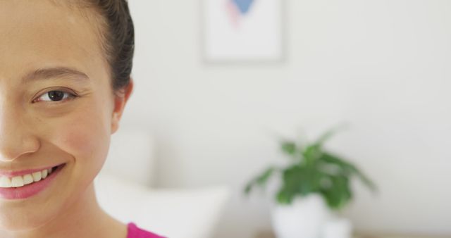 Close-Up of Smiling Woman in Bright, Minimalist Room - Download Free Stock Images Pikwizard.com