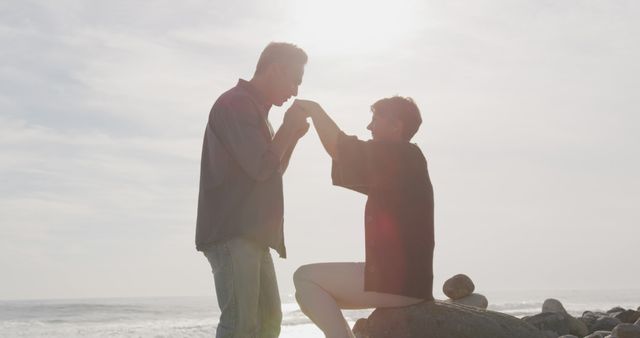 Romantic Couple Proposing Near Seaside with Sunlight - Download Free Stock Images Pikwizard.com