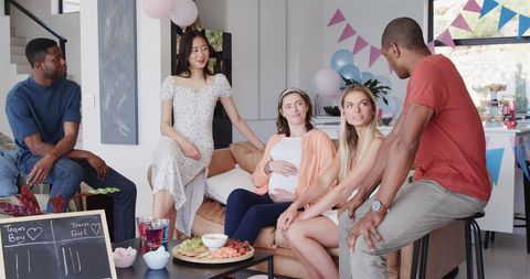 Diverse Friends Celebrating Baby Shower at Bright Summer Gathering