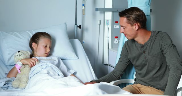 Father Comforting Young Daughter in Hospital Bed - Download Free Stock Images Pikwizard.com