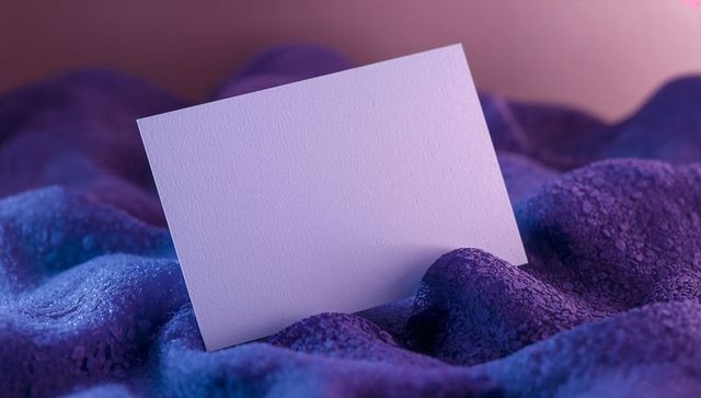 Minimalist White Card on Luxurious Purple Fabric for Product Display