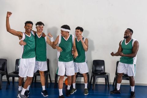 Basketball Team Celebrating Victory with Joyful Enthusiasm