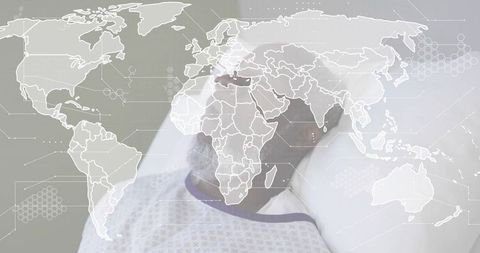 Mature male patient lying on clinic bed with digital world map overlay conveying telemedicine