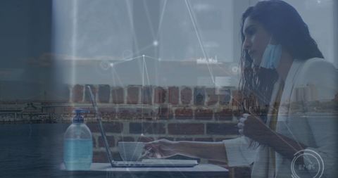 Businesswoman Wearing Face Mask Analyzing Data with Urban Landscape Overlay
