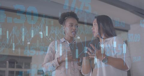 Diverse Businesswomen Analyzing Financial Data