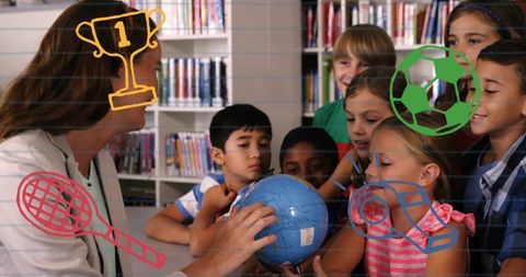Teacher guiding elementary students with globe in library, exploring geography and future goals