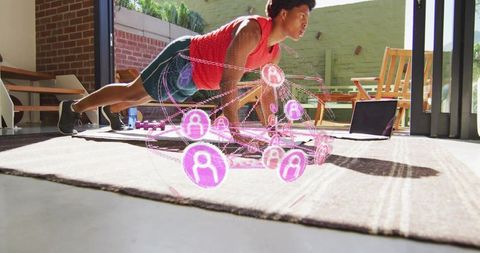 Man holding plank on mat at home with holographic fitness network and virtual coaching