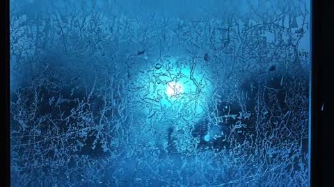 Pulsing Cyan Light Through Frosted Window Glass Backlit Condensation Close-Up Loop