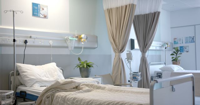 Hospital room featuring two bed spaces with clean white sheets, beige curtains for privacy, and modern medical equipment. Empty beds suggest readiness for new patients. Useful for healthcare facility promotions, patient care illustrations, and medical articles.