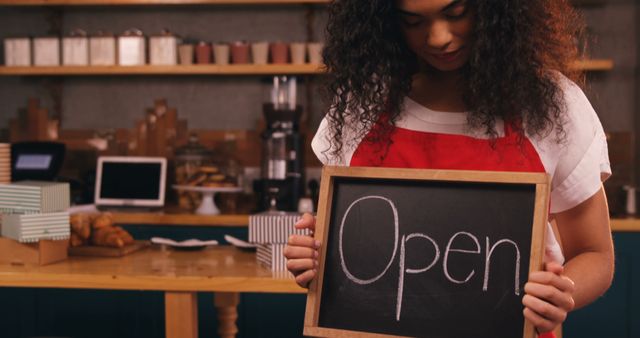 Young Female Barista Holding Open Sign in Cozy Coffee Shop - Download Free Stock Images Pikwizard.com