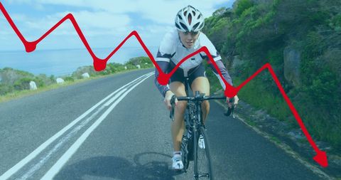 Cyclist navigating road while overlaid with financial trend line