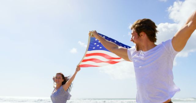 Couple Celebrating Independence Day with American Flag on Beach - Download Free Stock Images Pikwizard.com