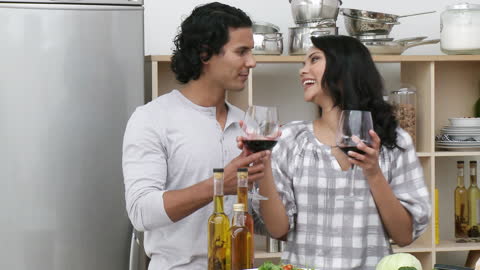 Couple Cooking Together and Enjoying Wine in Modern Kitchen