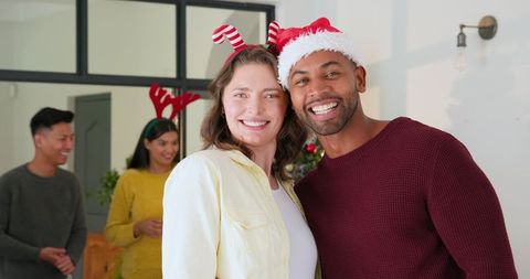 Friends Celebrating Holiday Season Wearing Festive Accessories