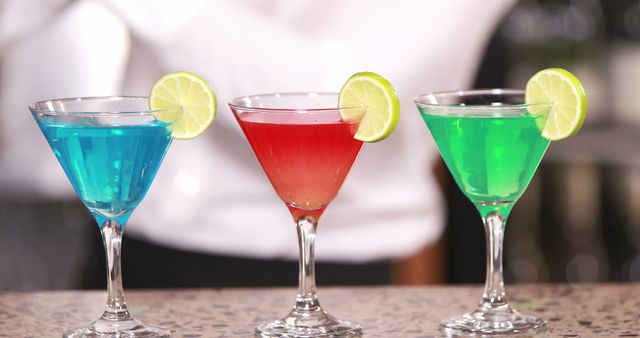 Colorful Cocktails With Lime Wedges at Bar Counter - Download Free Stock Images Pikwizard.com