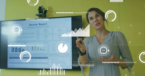 Businesswoman presenting analytics with digital technology interface