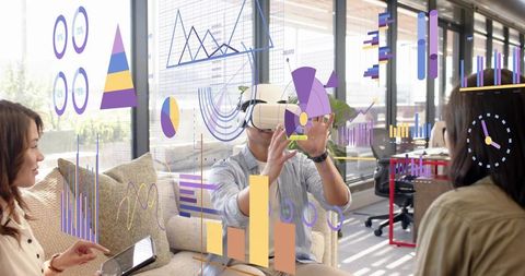 Man using vr headset manipulating floating data charts in collaborative office lounge