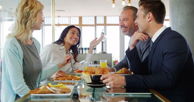 Smiling Business Colleagues Having Breakfast Meeting - Download Free Stock Images Pikwizard.com