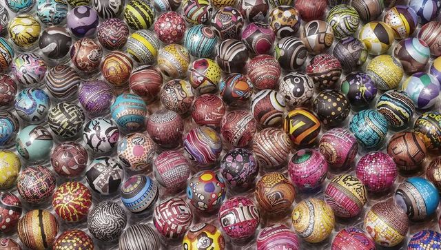 Displaying Tightly Packed Hand-Painted Spheres Glossy Reflective Multicolor Mosaic Orbs