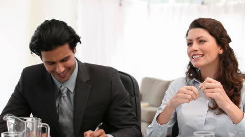 Professional Team Engaged in Business Meeting Discussion