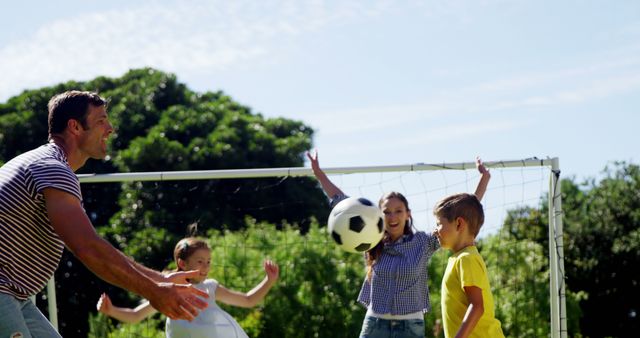 Family Enjoying Outdoor Soccer Game in Park on Sunny Day - Download Free Stock Images Pikwizard.com