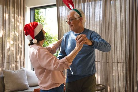 Senior Couple Celebrating Festive Season with Dance and Joy