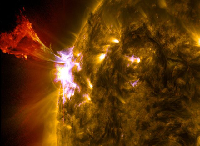 Image shows a dramatic solar prominence eruption along with an M-class solar flare captured by NASA on May 3, 2013. Solar material bursts off the Sun's surface, demonstrating powerful solar phenomena. Can be used for educational purposes, space science articles, or illustrating solar activity.