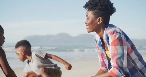 Mother Spending Quality Time with Kids on Sunny Beach
